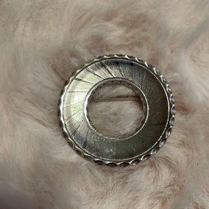 Silver metal wreath brooch